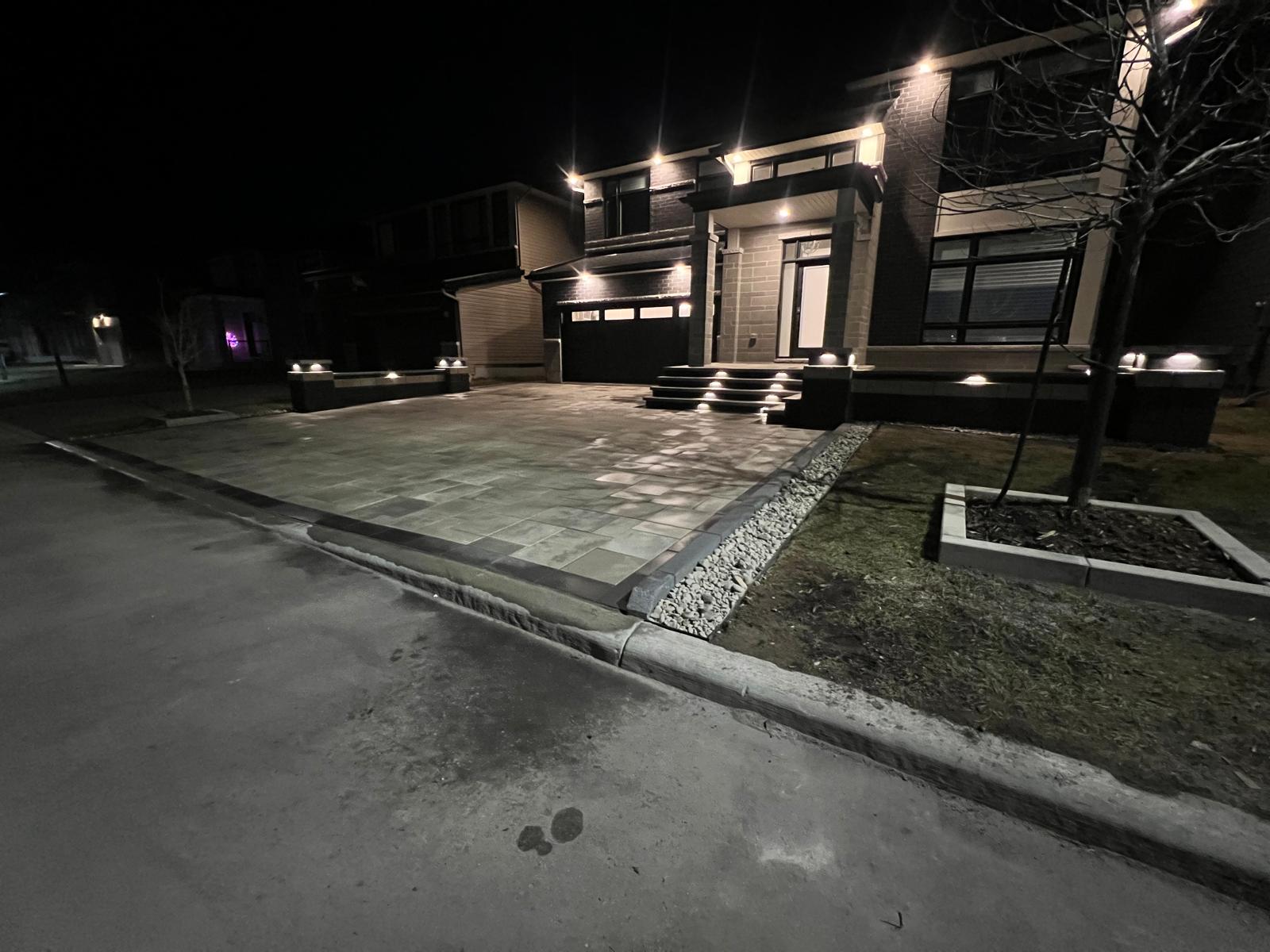 Night-lit interlocking driveway and front entrance